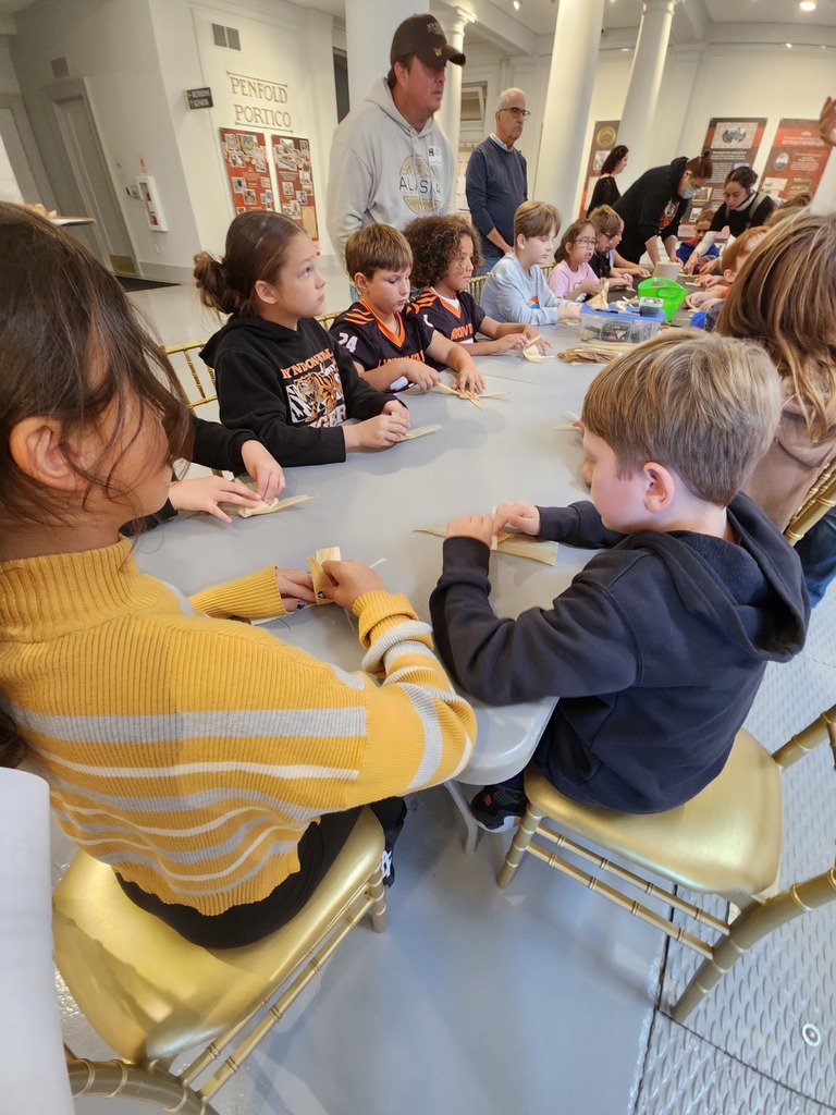students making corn dolls