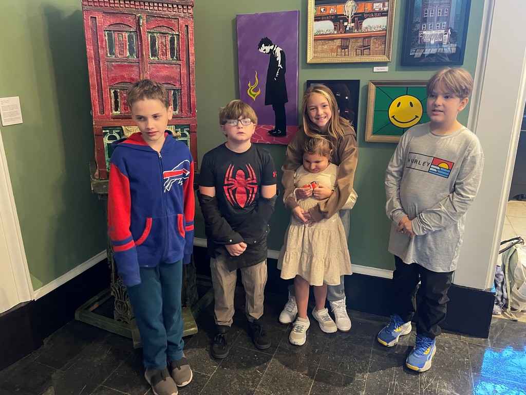 students posing for a photo in museum