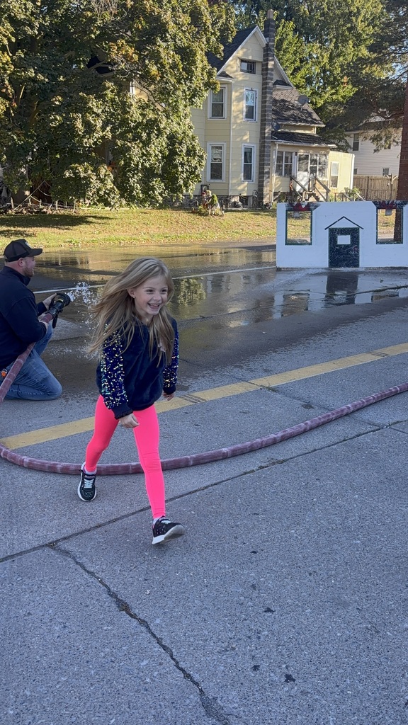 girl walking away from firehose