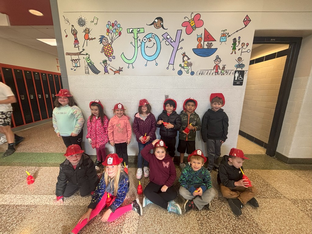 students earing fireman hats