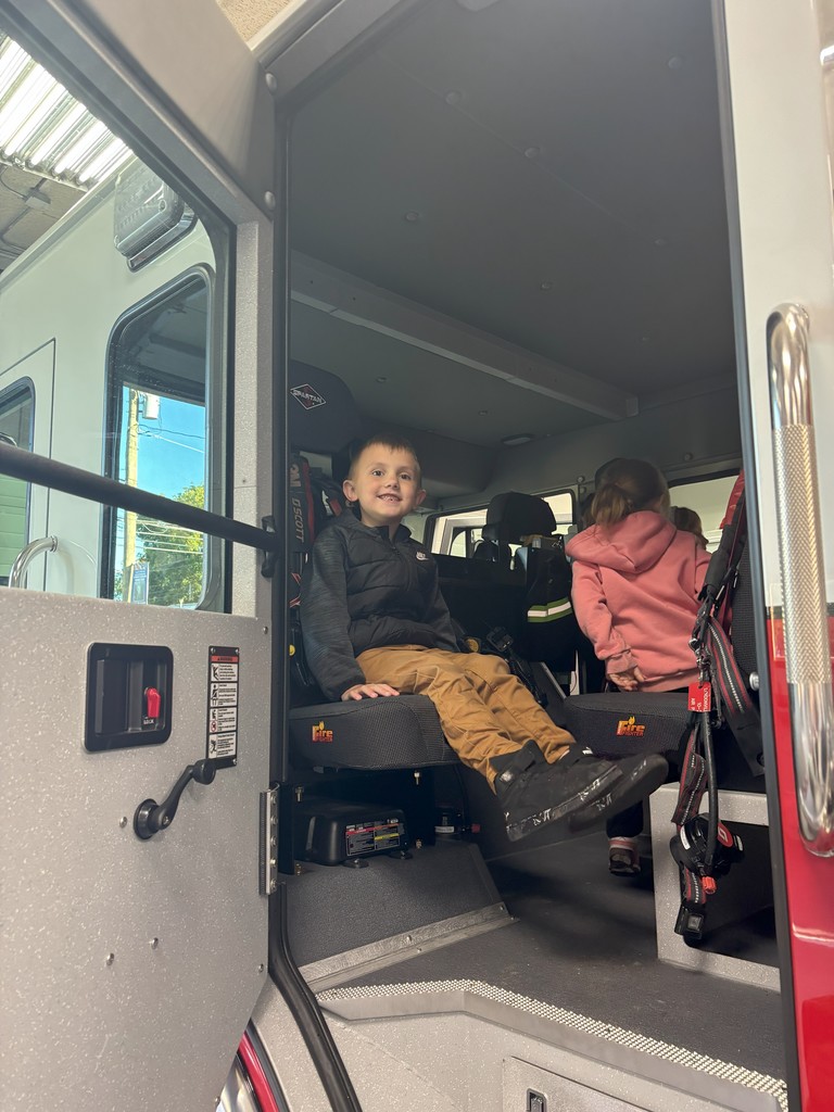 students inside firetruck