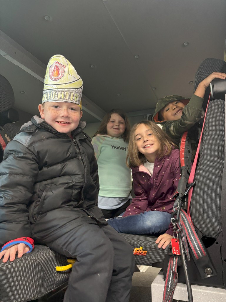 students inside firetruck