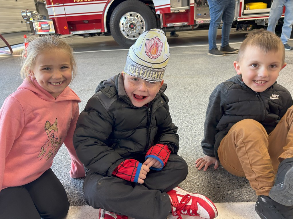 three students sitting in firehall