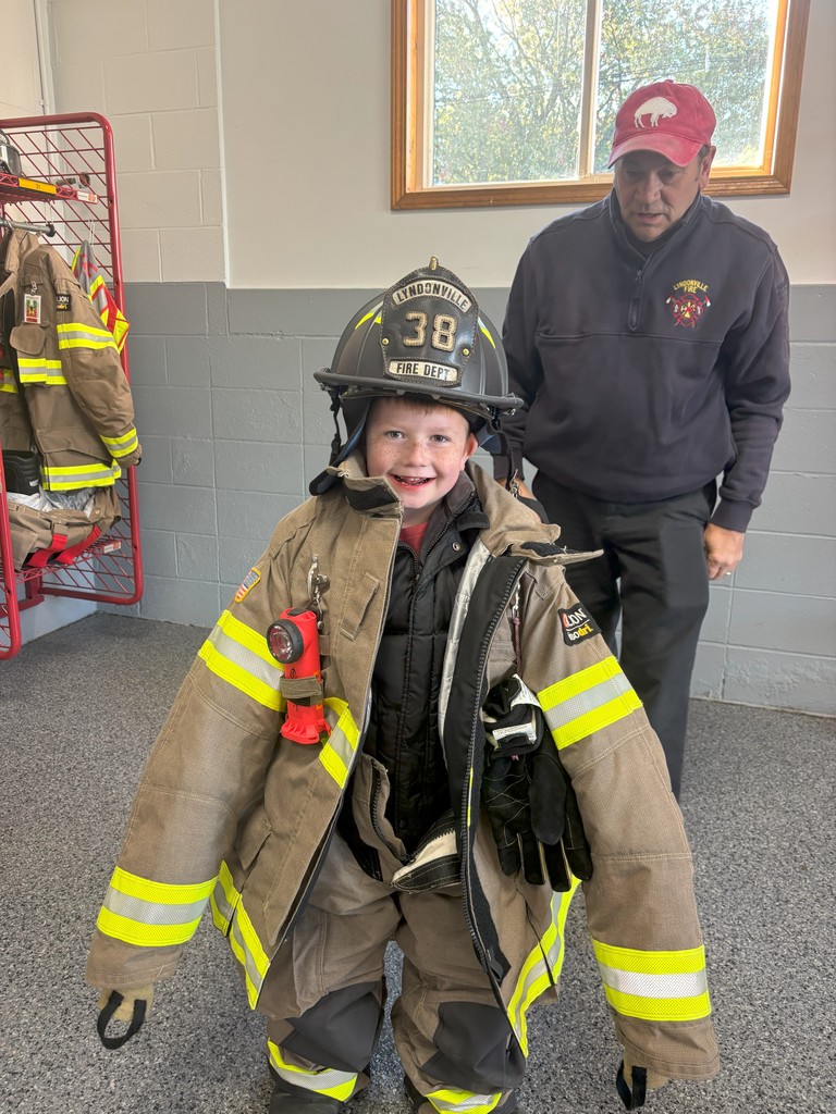 boy wearing fireman's gear