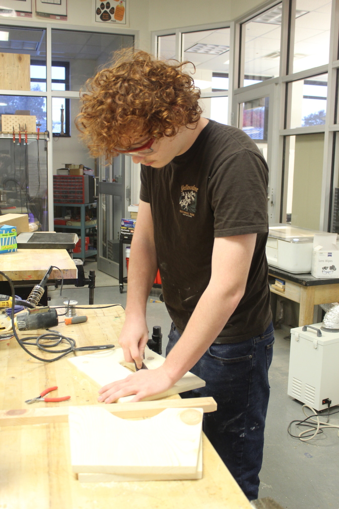 boy working on wooden project