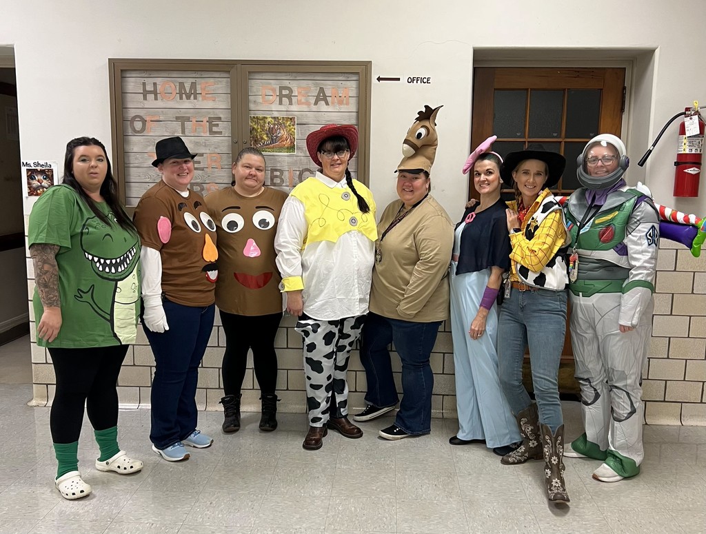 teachers wearing costumes from Toy Story