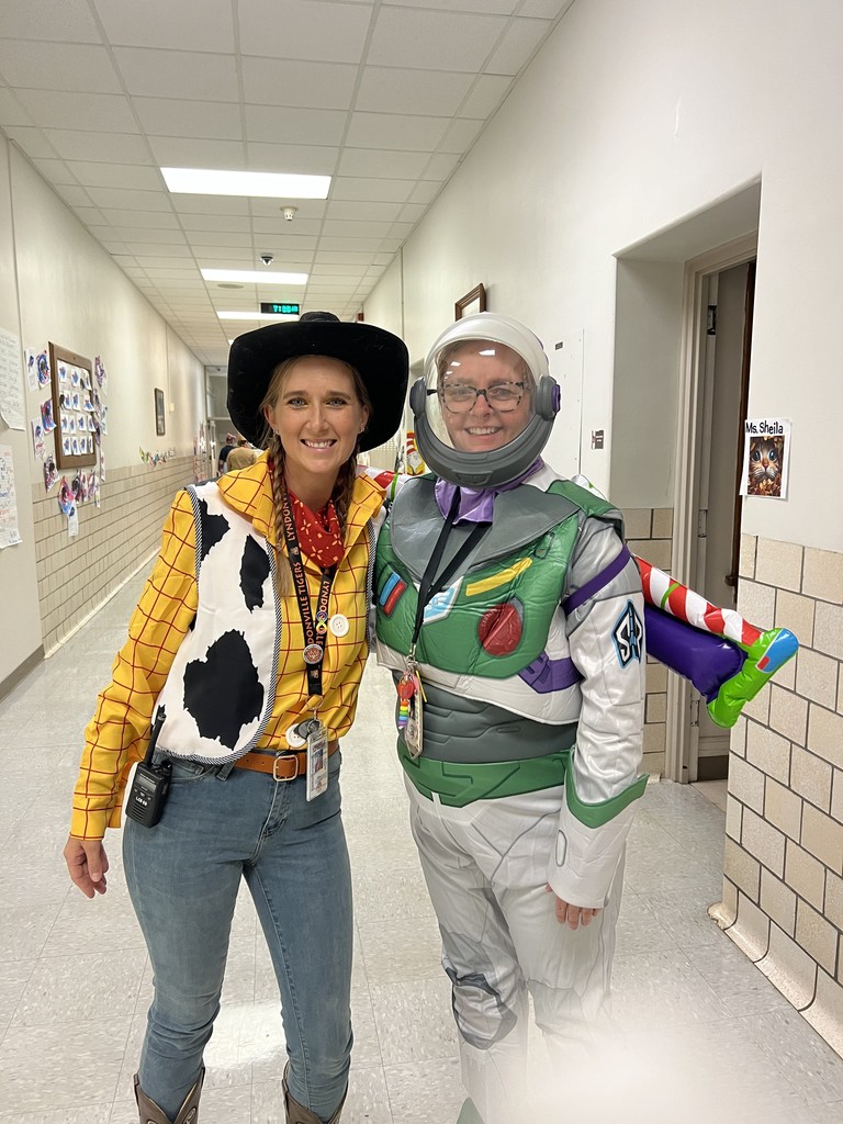 two teachers dressed as buzz and woody from toy story movie