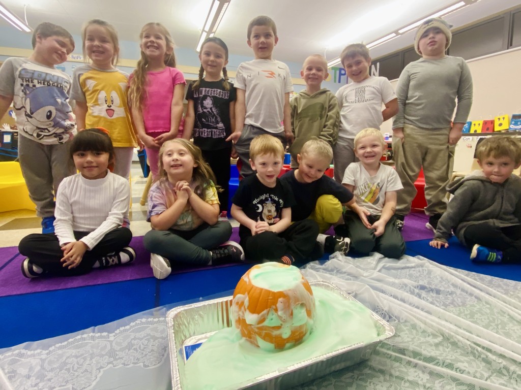 students in classroom looking at pumpkin experiment