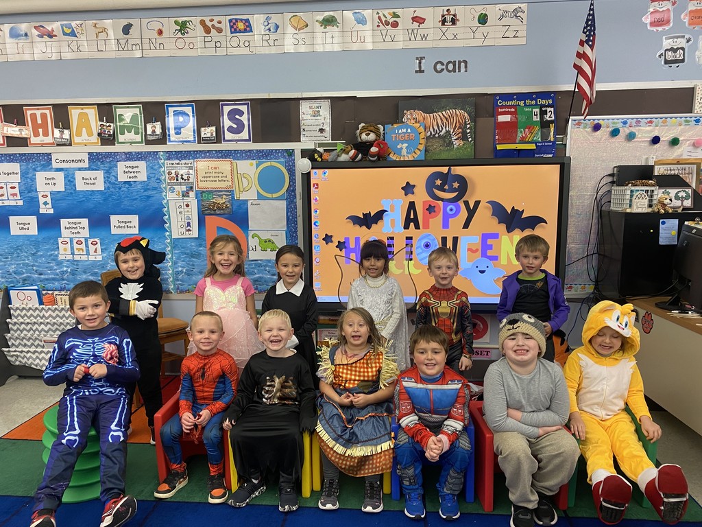 students in Halloween costumes in their classroom
