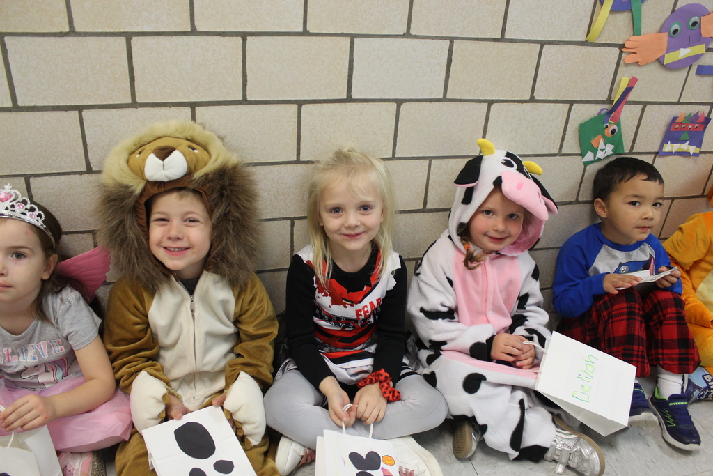 students lined up in hallway wearing costumes