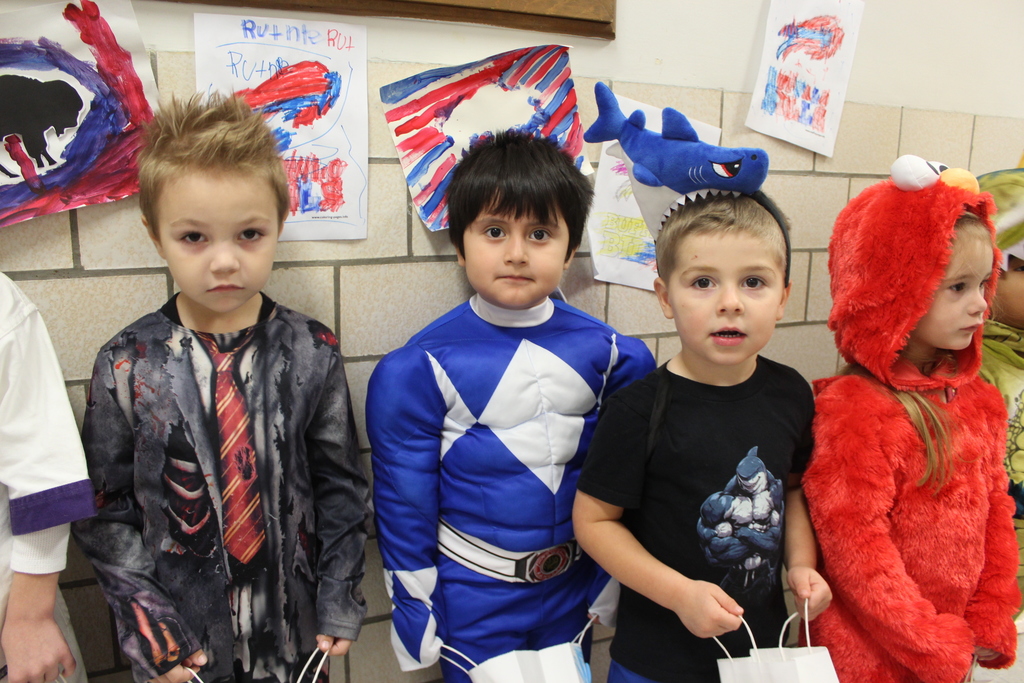 students lined up in hallway wearing costumes