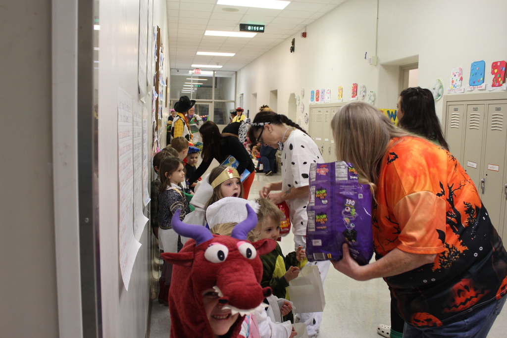 students receiving treats from staff members