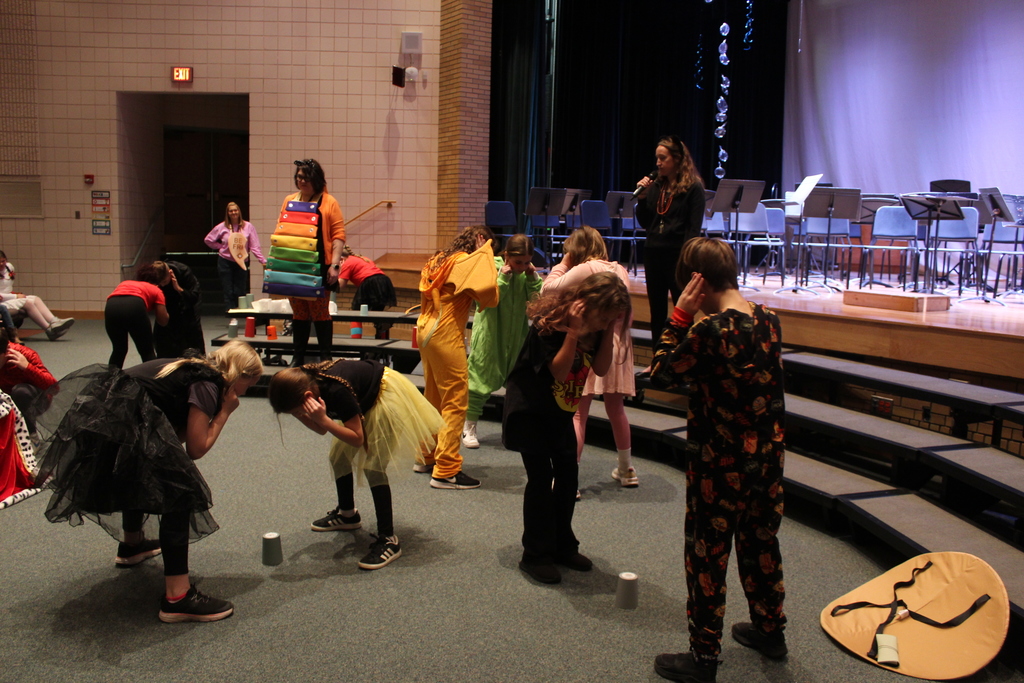 students playing game in auditorium
