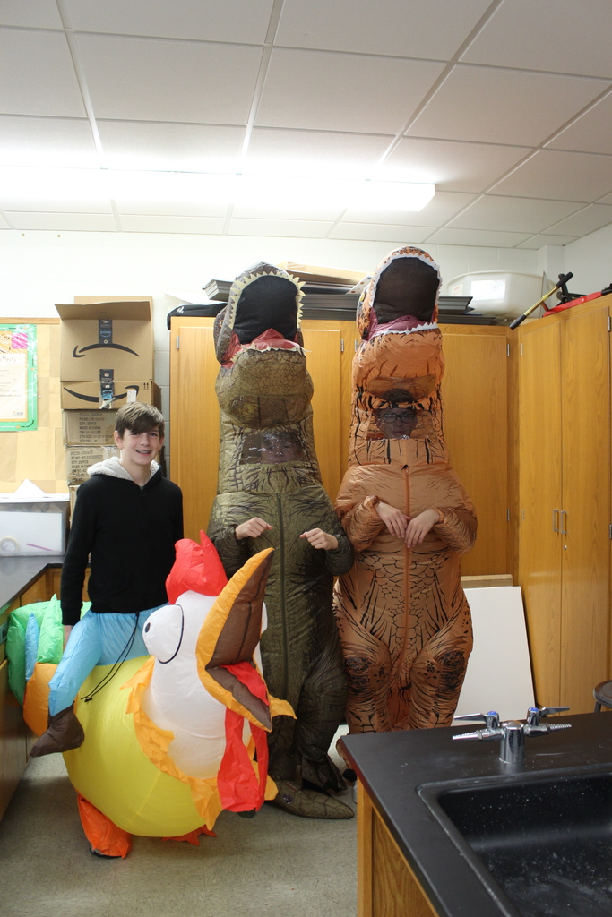 three students dressed in inflatable costumes