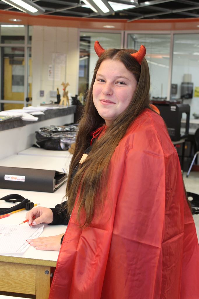 girl dressed as devil in classroom