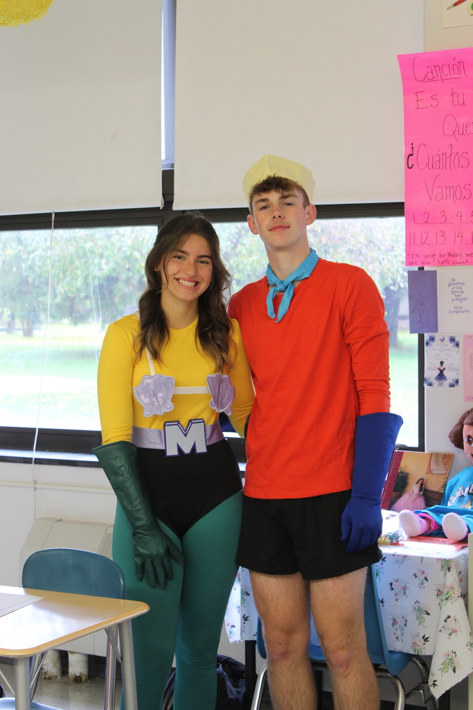 boy and girl in superhero costumes