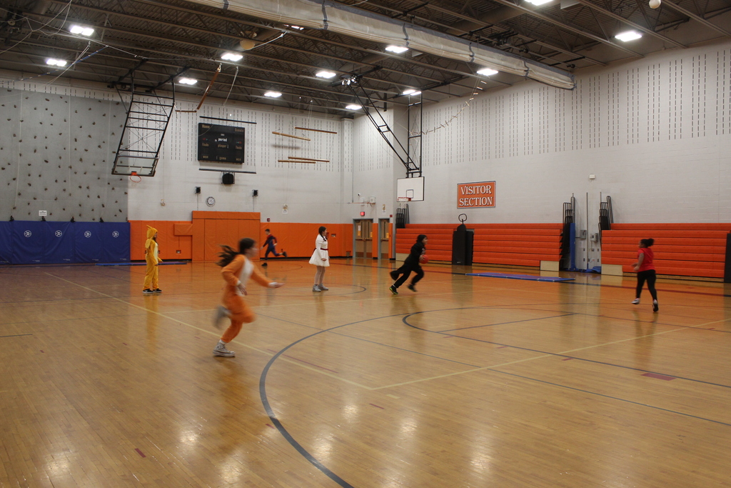 students playing kickball in gym