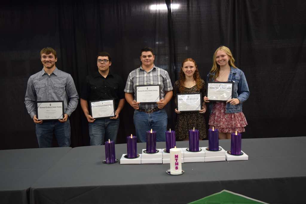 five students standing holding certificates