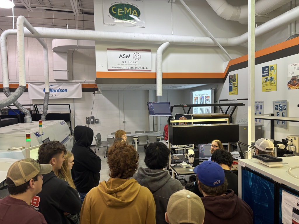 students listening to a speaker in a tech workshop