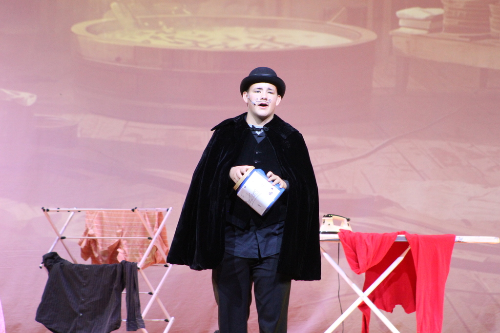 student standing on stage