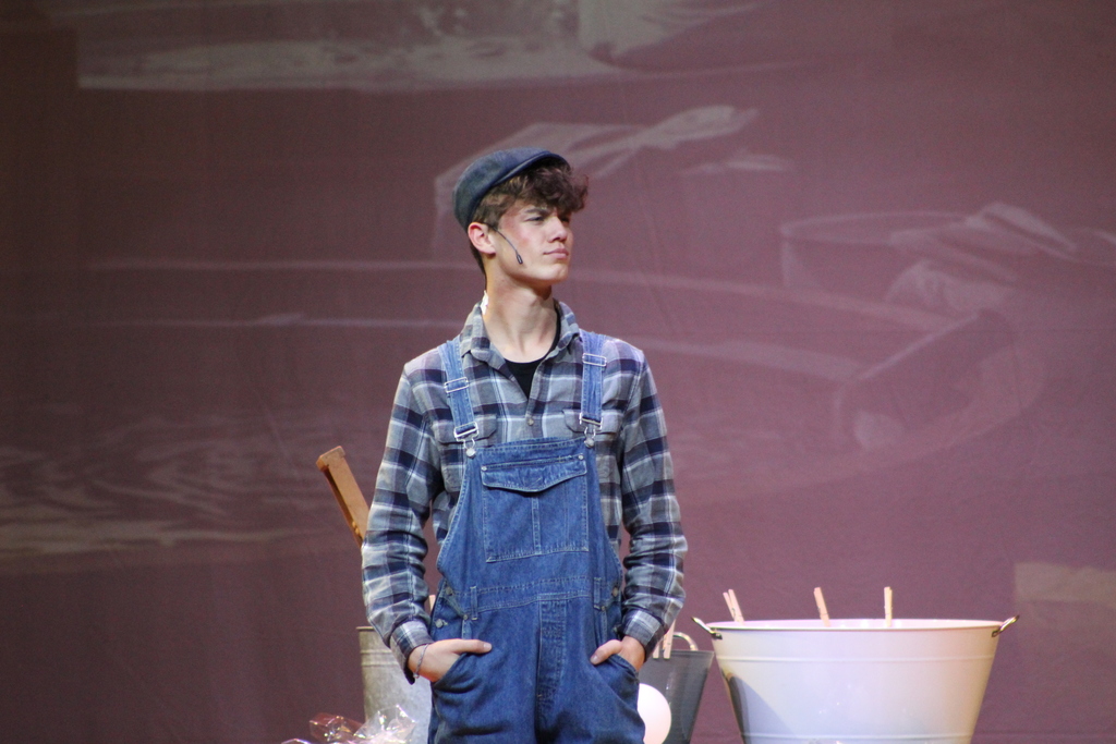 student standing on stage