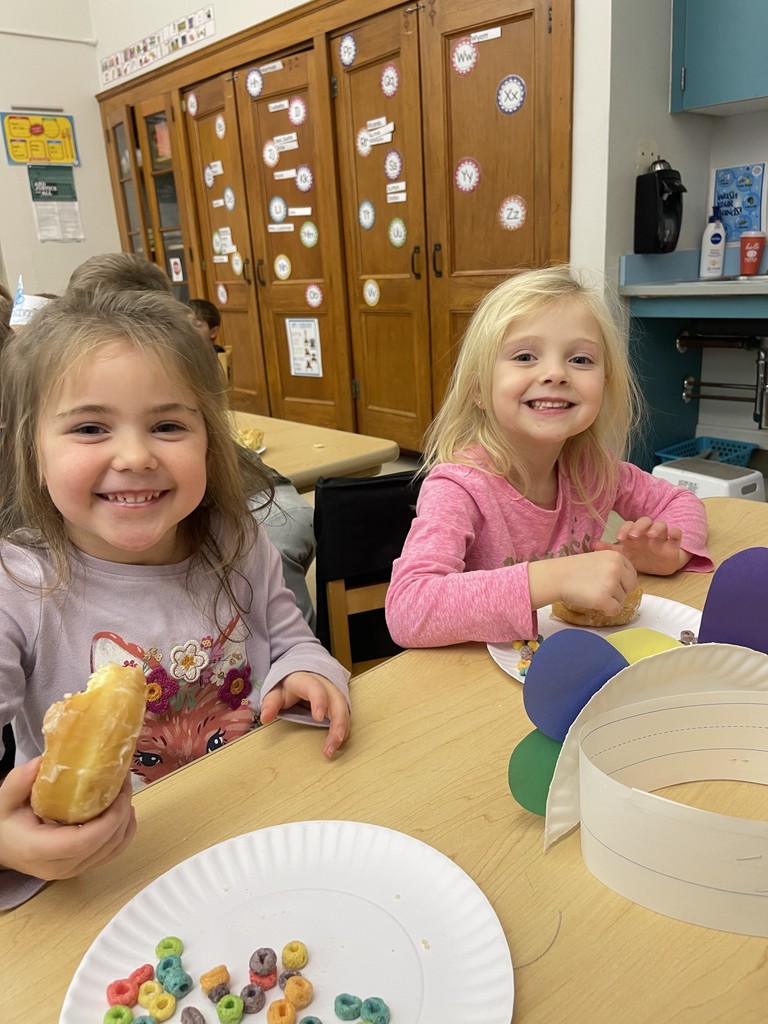 students sitting at a table eating