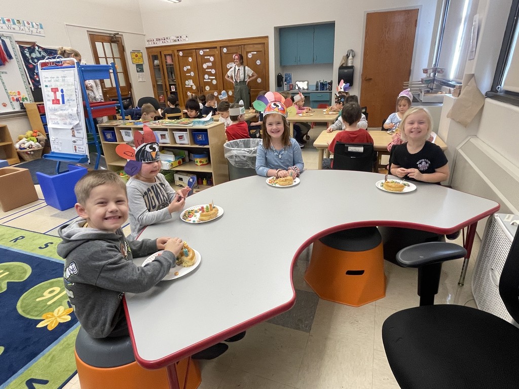 students sitting at a table eating