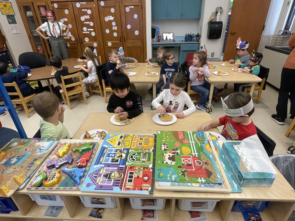 students sitting at a table eating