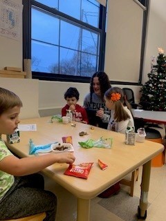 students seated at table doing an activity
