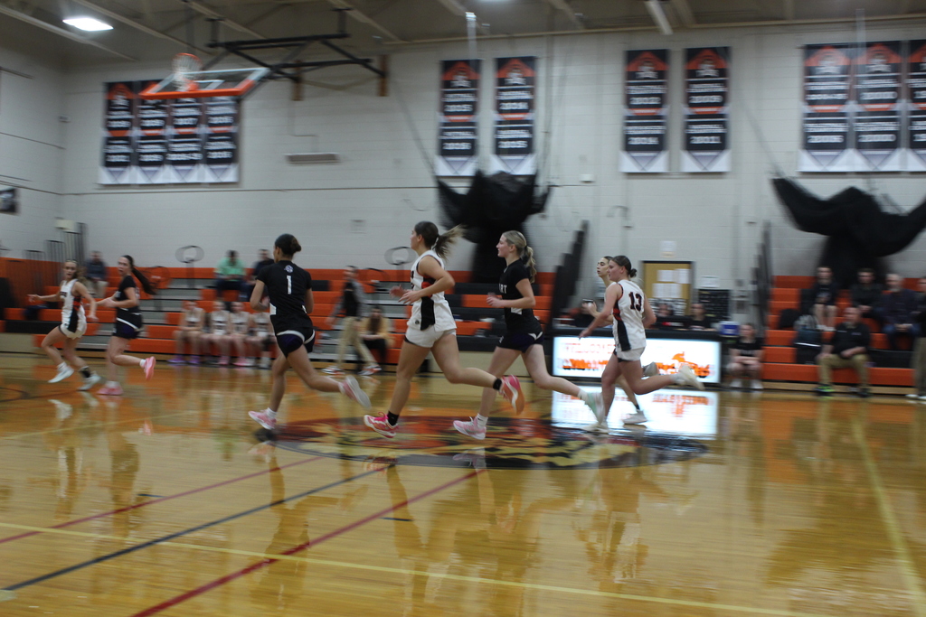 girls playing basketball in gym
