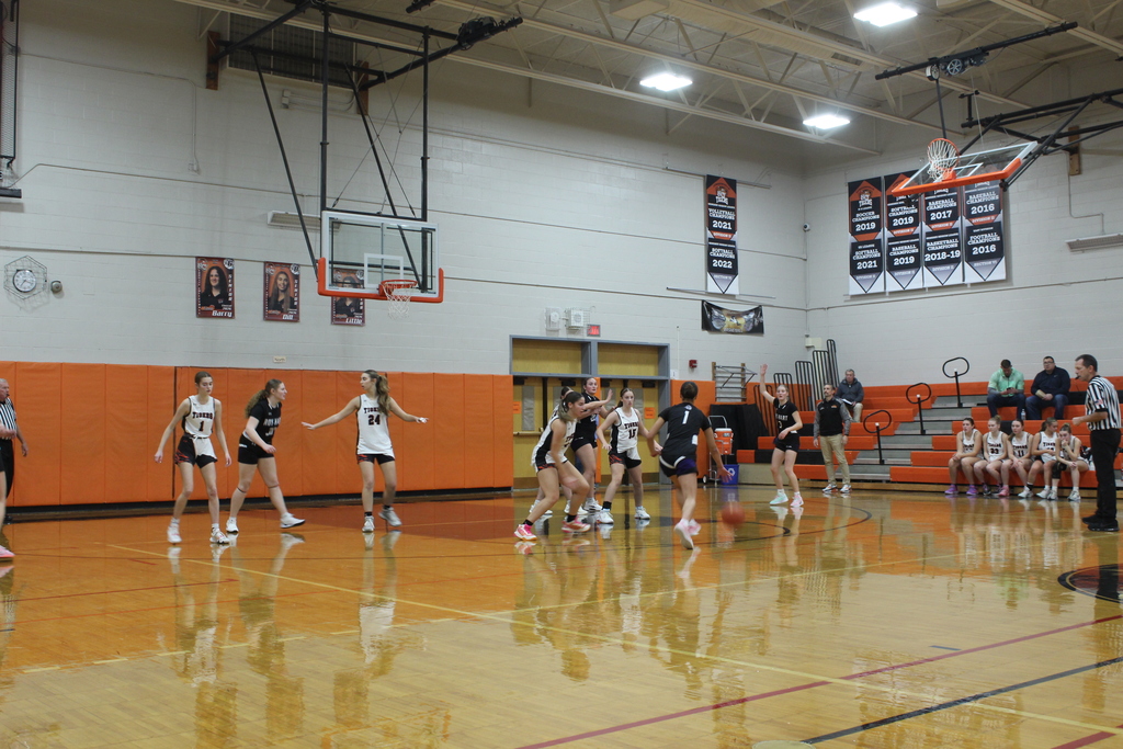 girls playing basketball in gym