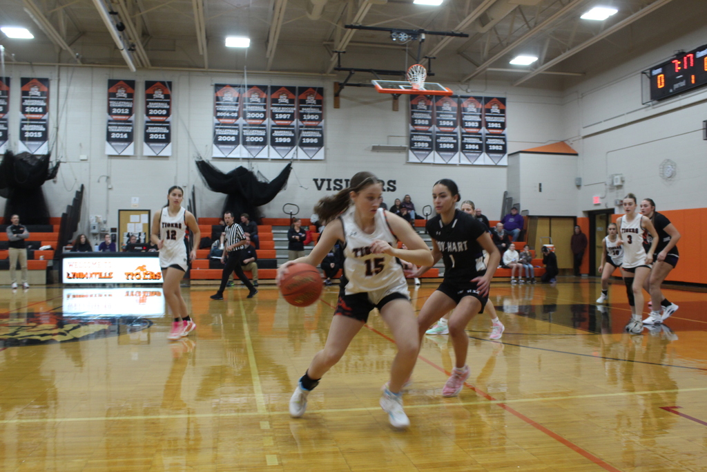 girls playing basketball in gym