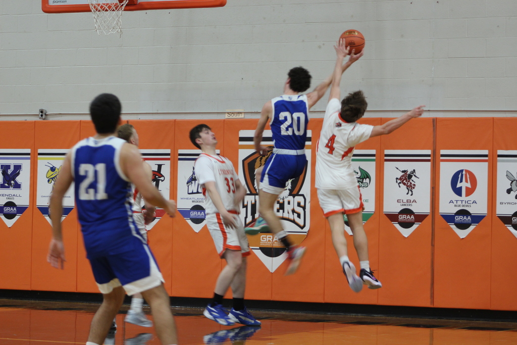 boys playing basketball in gym
