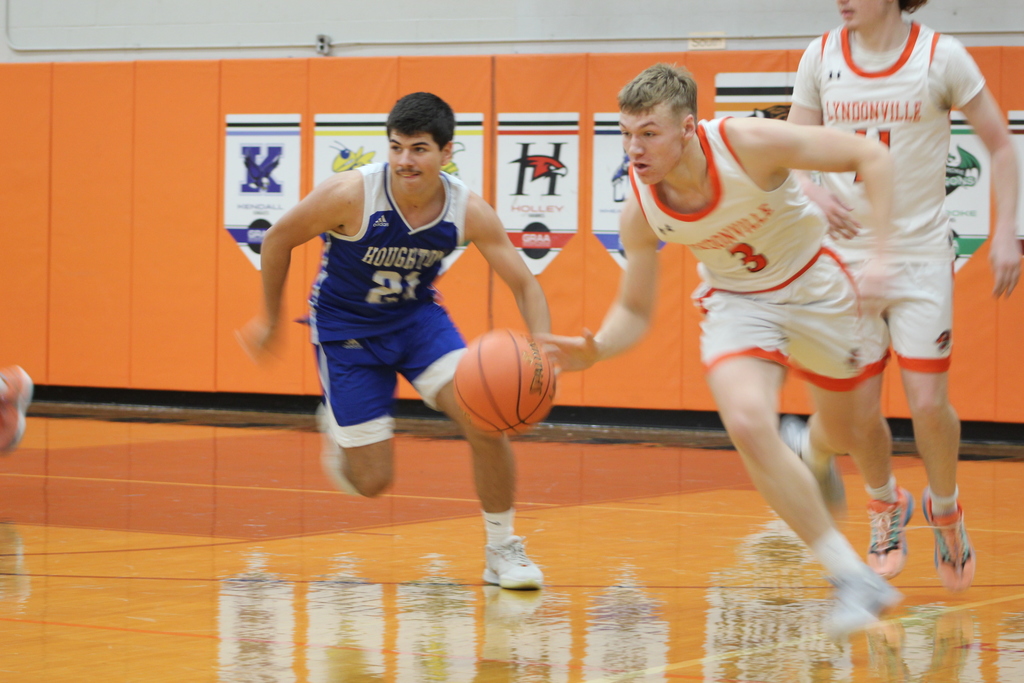 boys playing basketball in gym
