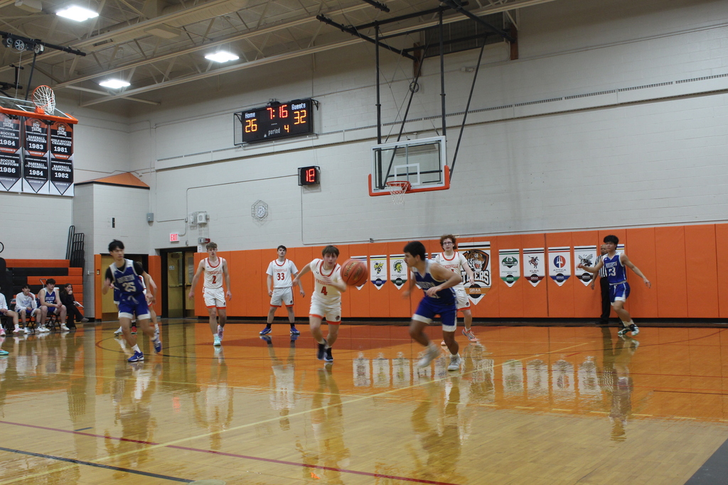 boys playing basketball in gym