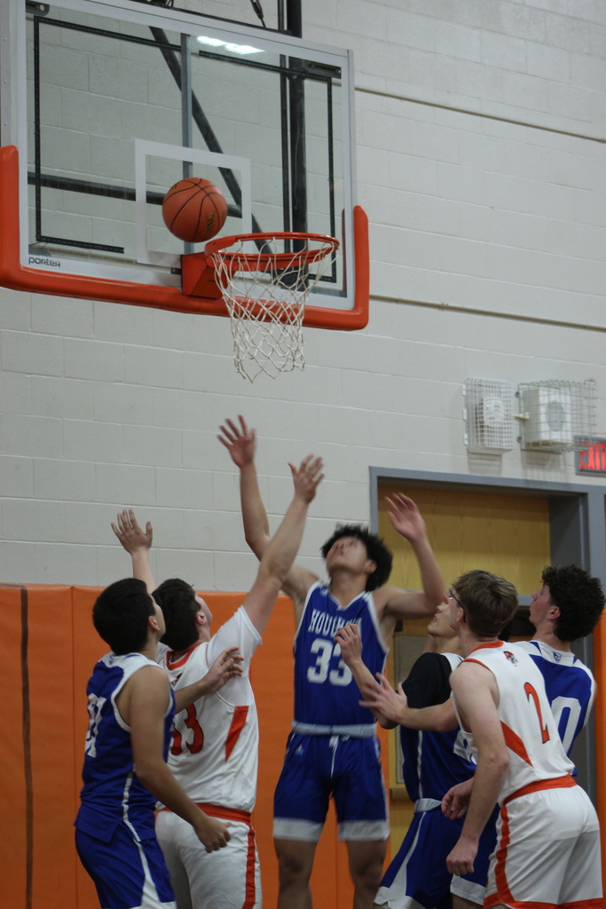 boys playing basketball in gym