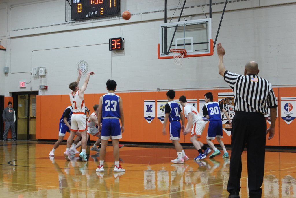 boys playing basketball in gym