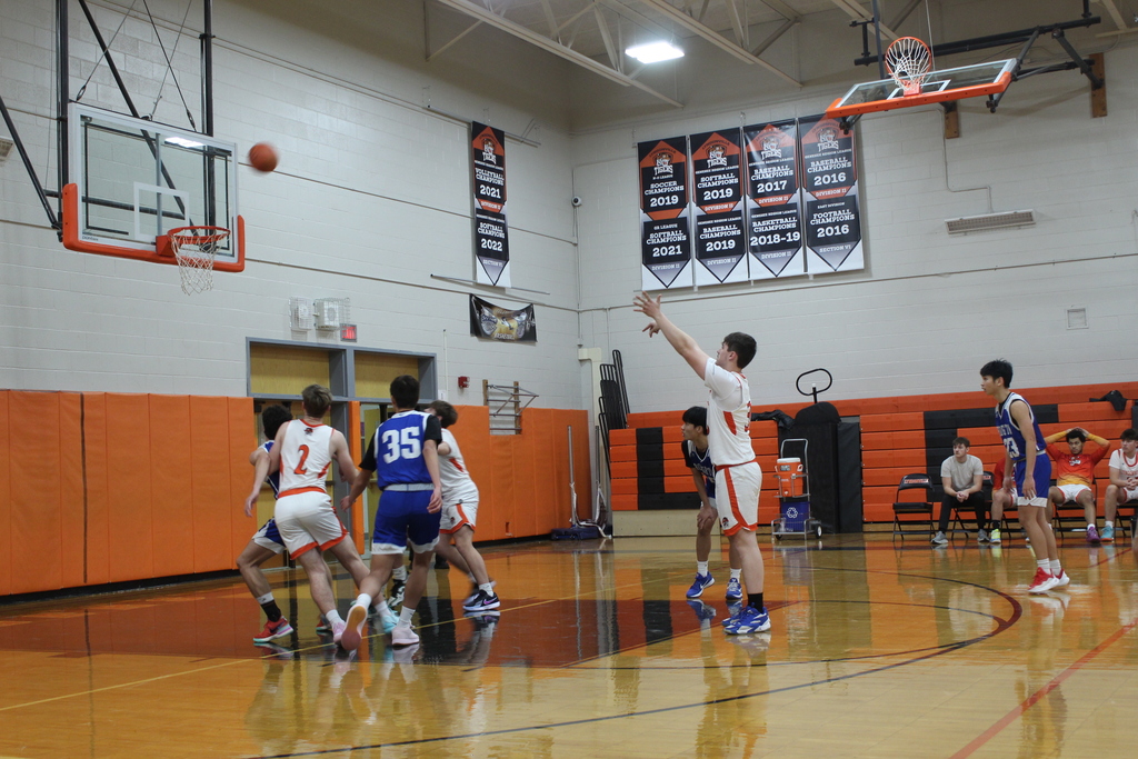boys playing basketball in gym