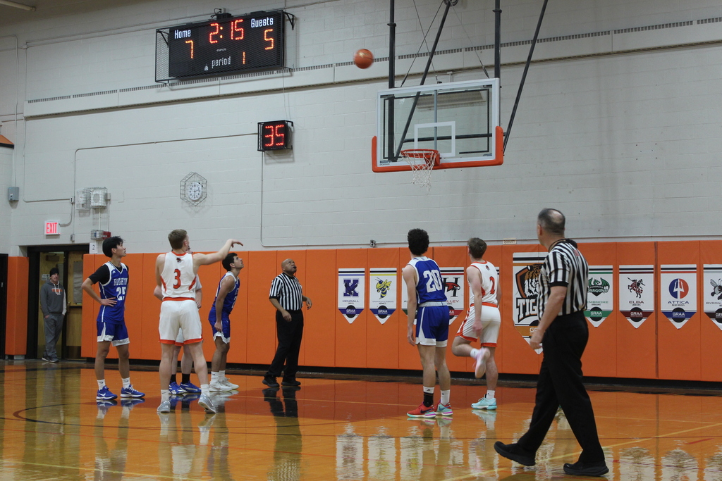 boys playing basketball in gym
