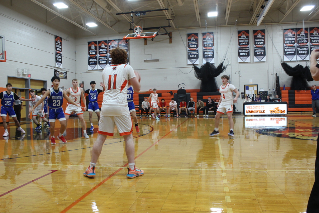 boys playing basketball in gym