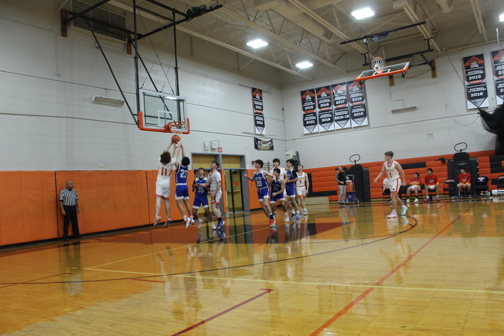 boys playing basketball in gym