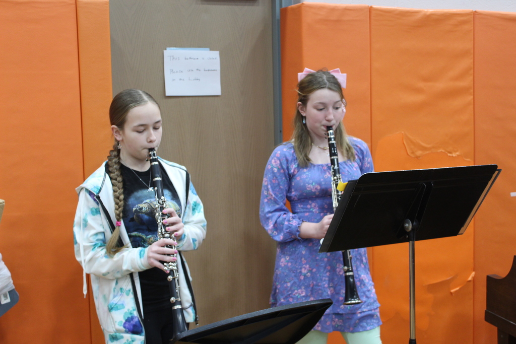 two students playing clarinets