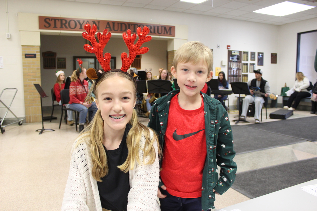 two kids dressed in holiday attire