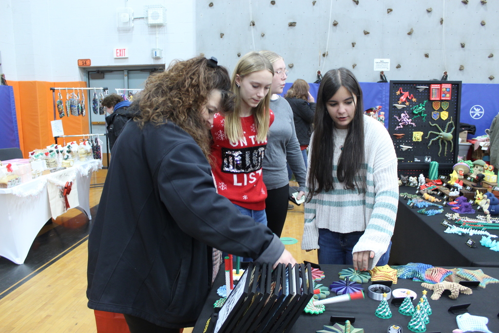 people shopping at booths