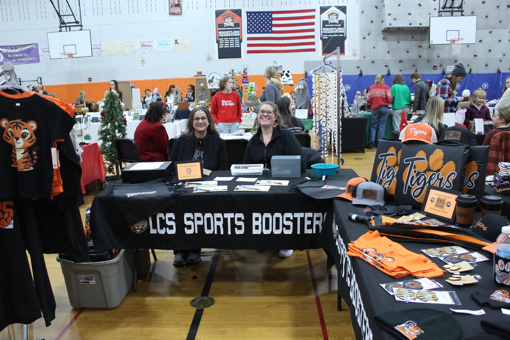two ladies selling sports boosters items