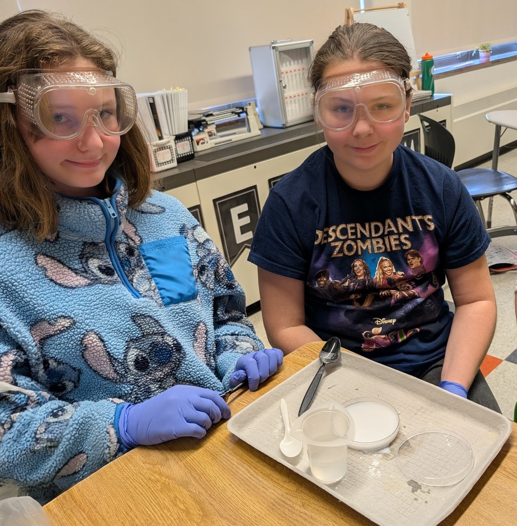 students working on a science experiment