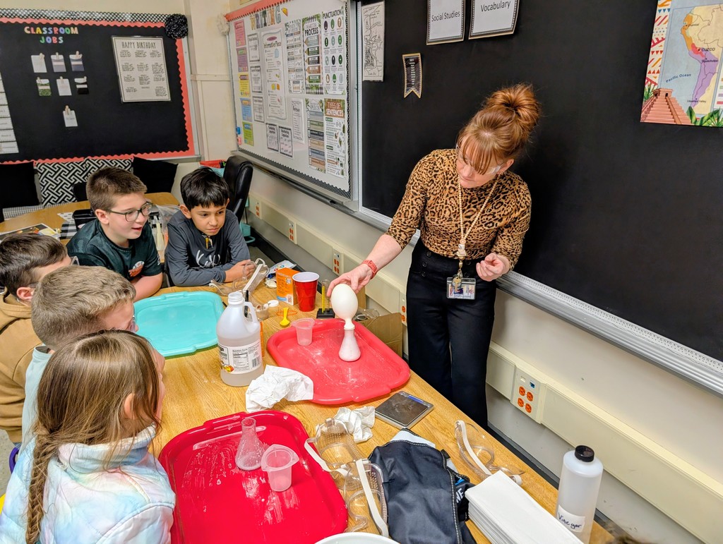 students working on a science experiment