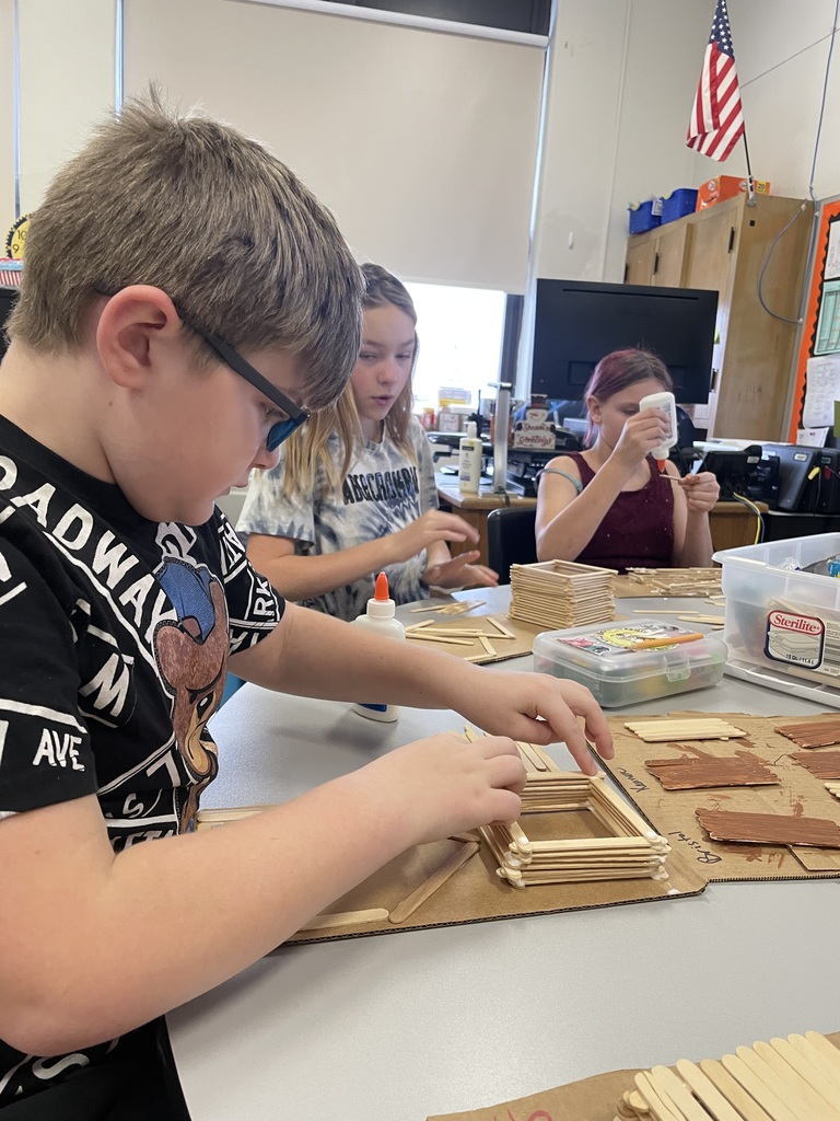 students working on a popsicle stick project