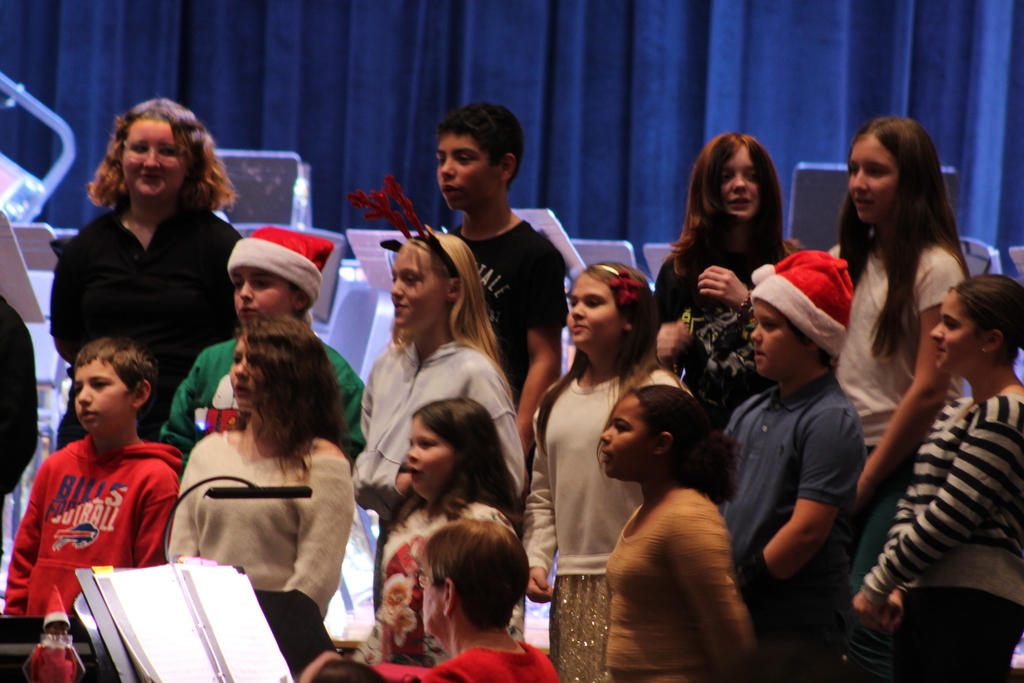 students singing in choir on risers