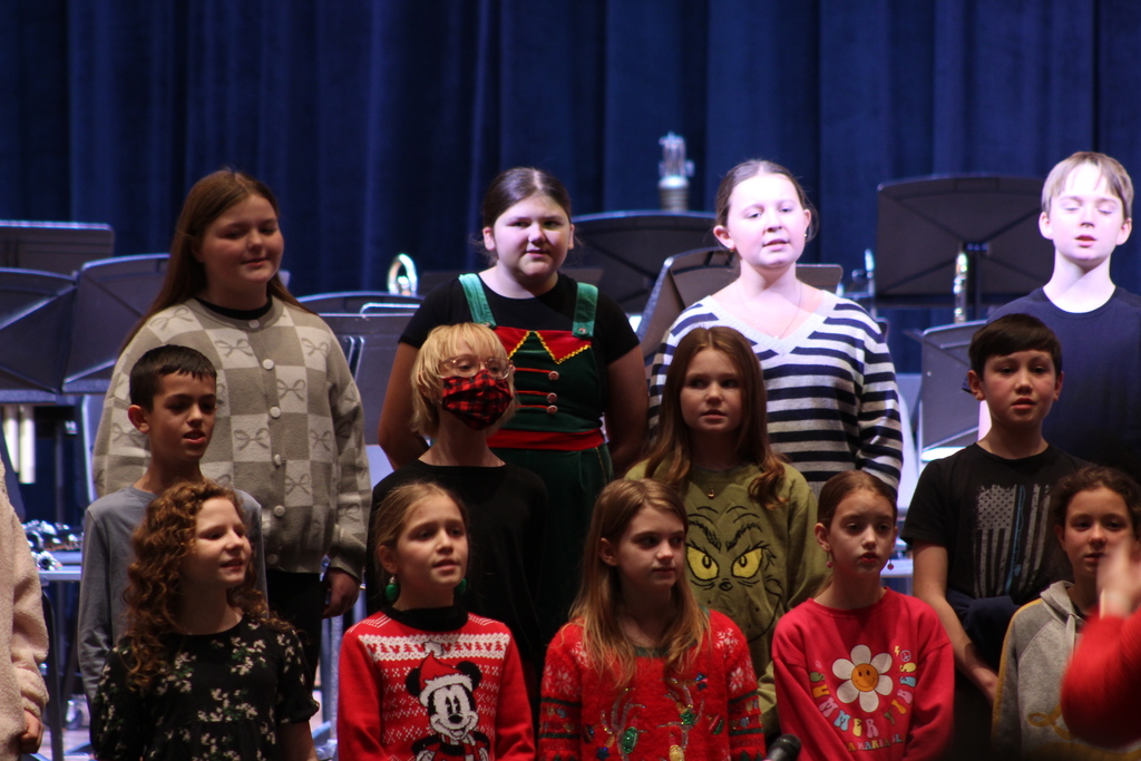students singing in choir on risers